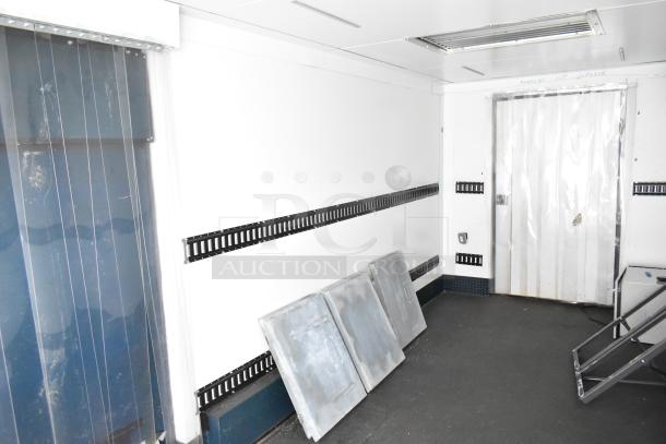 2020 Southern Dimensions 8.5' x 24' enclosed insulated trailer interior, mobile walk-in cooler with strip curtain and wall racks.