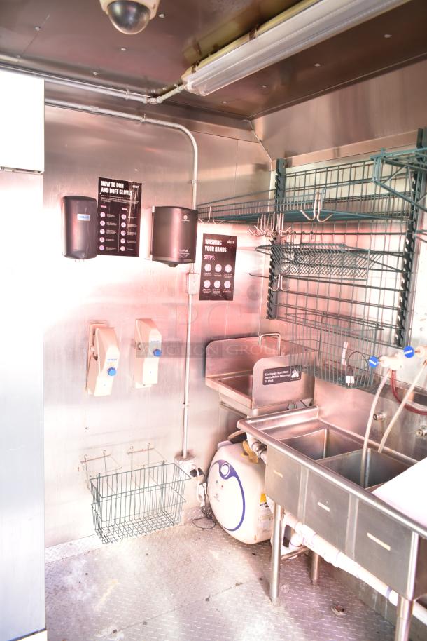 2020 Continental Cargo 8.5' x 28' mobile kitchen trailer interior with sinks, shelving, and handwashing stations visible.