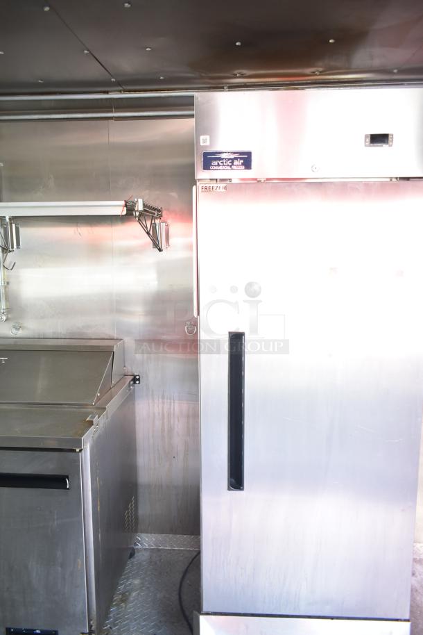 2020 Continental Cargo 8.5'x28' mobile kitchen trailer interior, featuring stainless steel Arctic Air commercial freezer.