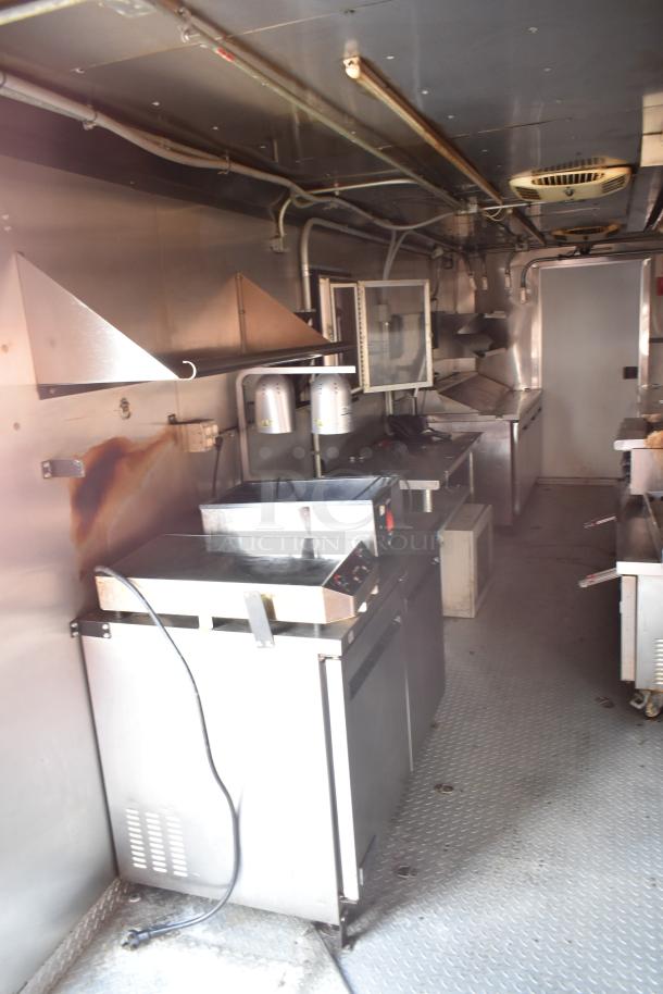 2020 Continental Cargo 8.5' x 28' enclosed mobile kitchen trailer, equipped with hot cooking line, refrigeration, and hood system.