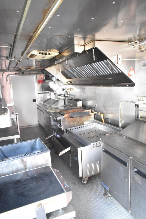 2020 Continental Cargo 8.5' x 28' mobile kitchen trailer with full cooking line, refrigeration, prep stations, and hood system.