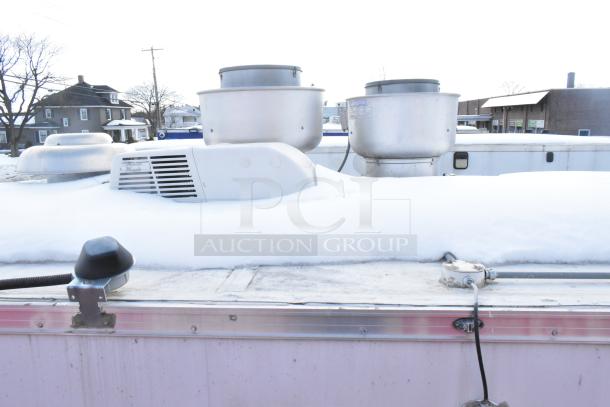 2020 Continental Cargo 8.5' x 28' mobile kitchen trailer rooftop view, showing HVAC and ventilation equipment under snow.