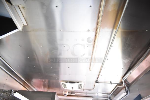 Interior view of a 2020 Continental Cargo mobile kitchen trailer, showing ceiling details with HVAC and lighting fixtures.