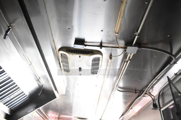 Interior of 2020 Continental Cargo 8.5' x 28' mobile kitchen trailer, featuring HVAC and stainless steel ceiling with wiring.