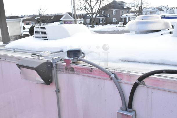 2020 Continental Cargo mobile kitchen trailer exterior, snow on roof, HVAC unit, vent, electrical conduit visible.