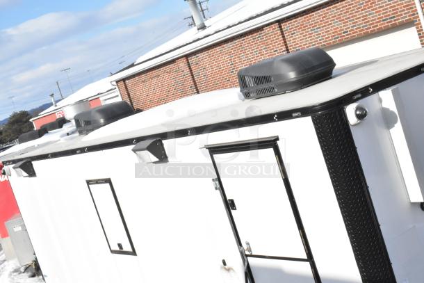 2021 Southern Dimensions 8.5' x 24' enclosed trailer, white exterior, black trim, roof equipment visible, excellent condition.