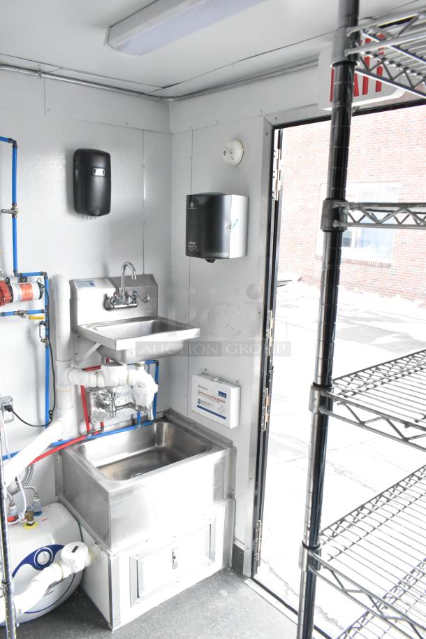 2021 Southern Dimensions refrigerated trailer interior, featuring a clean sink, plumbing, and shelf. Excellent condition.