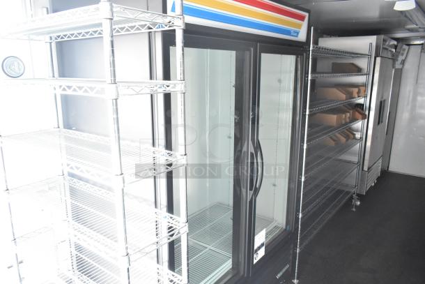 2021 Southern Dimensions 8.5' x 24' trailer interior with True cooler, shelving, clean and excellent condition.