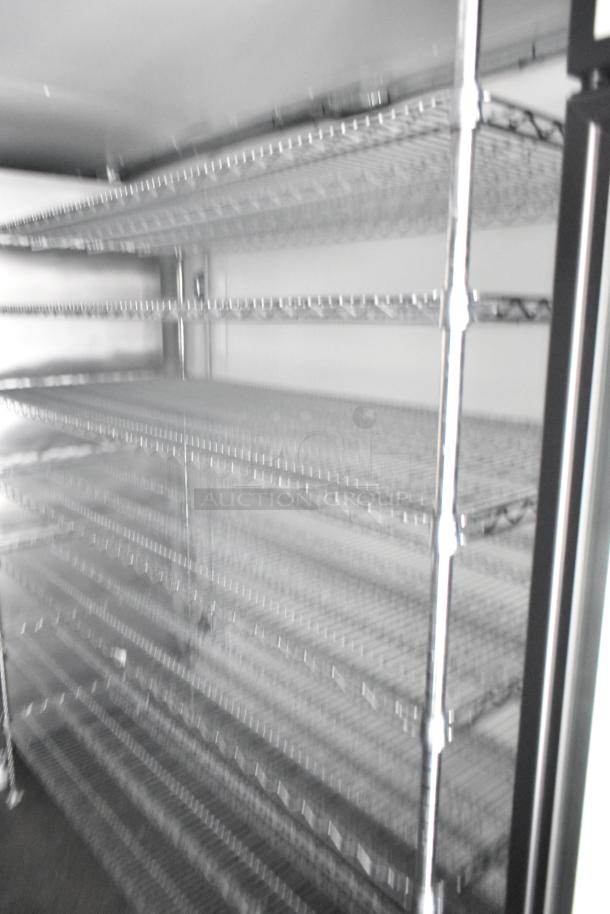 Interior of 2021 Southern Dimensions refrigerated trailer, featuring clean, well-maintained wire shelving.