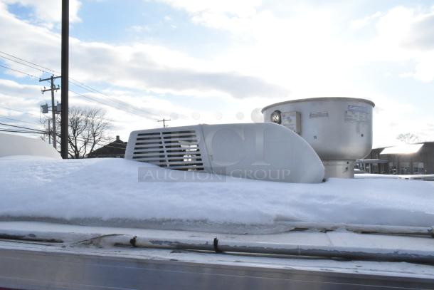 2021 Titanium Cargo mobile kitchen trailer roof with snow, featuring CaptiveAire exhaust vent and HVAC cover.