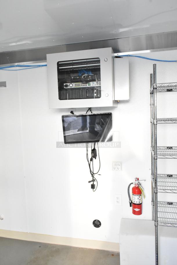 2021 Diamond Cargo trailer interior with HVAC, 48-port network, shelving, and fire extinguisher. Climate-controlled, great condition.