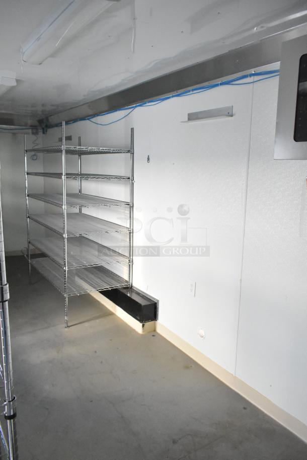 Diamond Cargo 8.5' x 24' mobile storage trailer interior with shelving, network cables, and power outlets. Climate-controlled, commercial-grade.