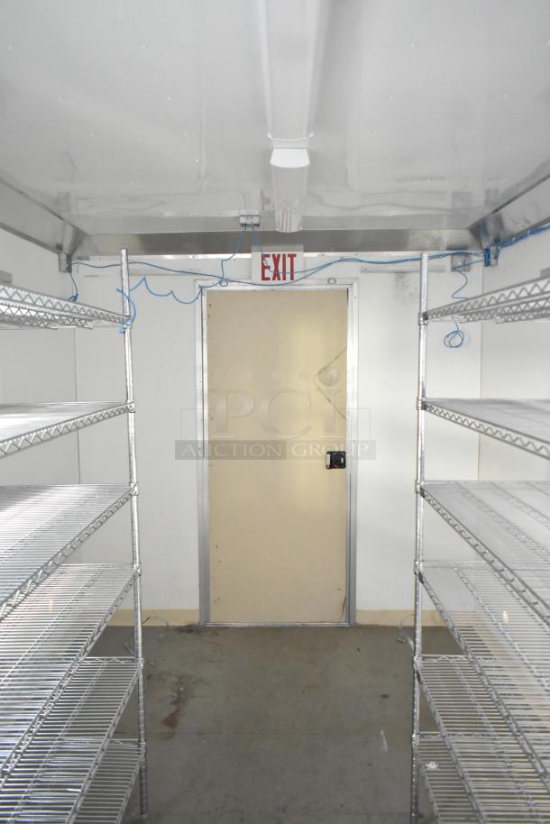Diamond Cargo 8.5' x 24' climate-controlled trailer interior with Metro shelving, exit door, wiring, and clean metal racks.