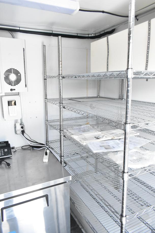 2021 Southern Dimensions 8.5' x 24' mobile cold storage trailer with metal shelving, POS workstation, and phone in near-new condition.