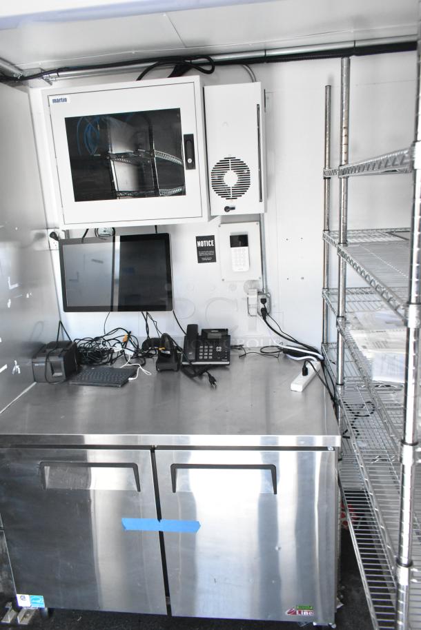 2021 Southern Dimensions mobile cold storage trailer: True coolers, Turbo Air freezers, POS workstation. Near-new, organized interior.