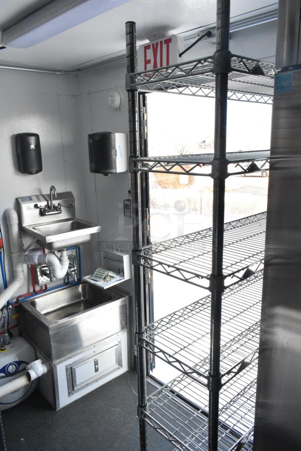 2021 Southern Dimensions 8.5' x 24' mobile cold storage trailer. Features shelves, sink, and self-contained water system. Near-new.