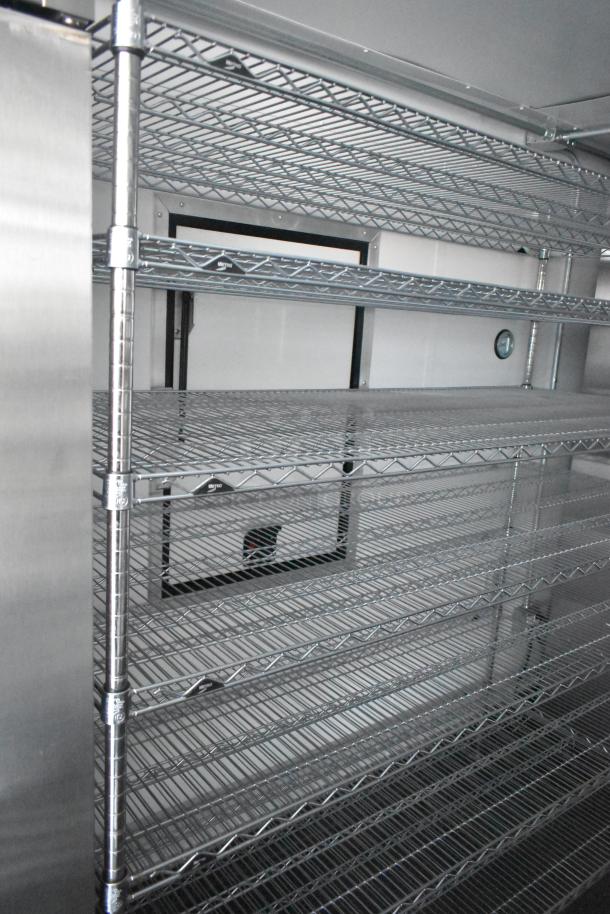 2021 Southern Dimensions cold storage trailer interior with wire shelving, near-new condition; part of mobile fulfillment unit.