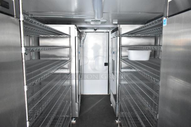 2021 Southern Dimensions mobile cold storage trailer interior with metal shelving, True coolers, and Turbo Air freezers. Near-new.