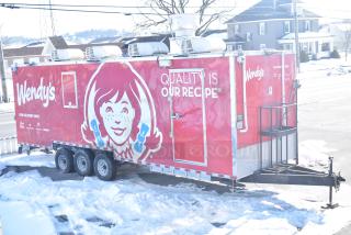 Rock Solid Cargo Wendy's-style fast-food trailer, red exterior, full commercial kitchen, turnkey for high volume service.