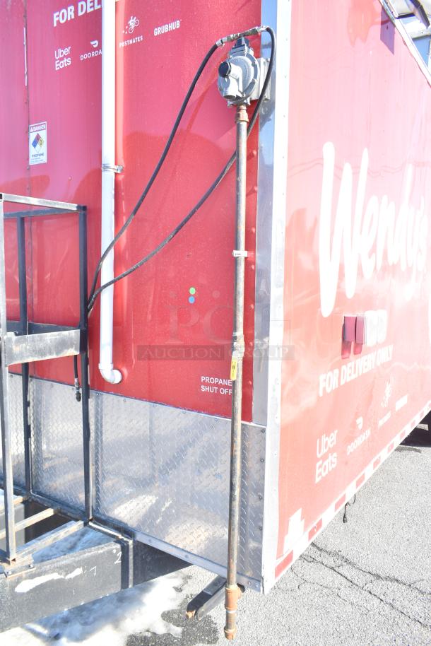 Rock Solid Cargo fast food trailer, Wendy's branding, propane shutoff visible, ideal for delivery services like Uber Eats.