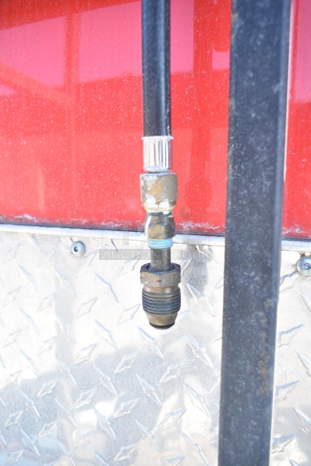 Close-up of a gas connection on a 2022 Rock Solid Cargo Wendy’s-style fast food trailer in good condition.