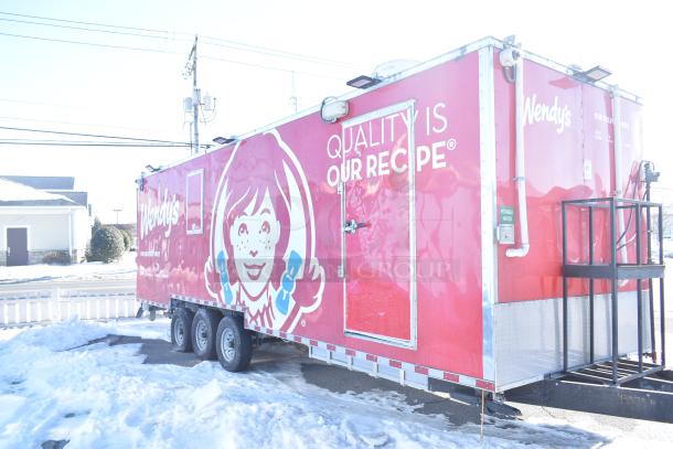 Rock Solid Cargo Wendy's-style fast food trailer, featuring branding and equipped for high-volume service with commercial-grade appliances.