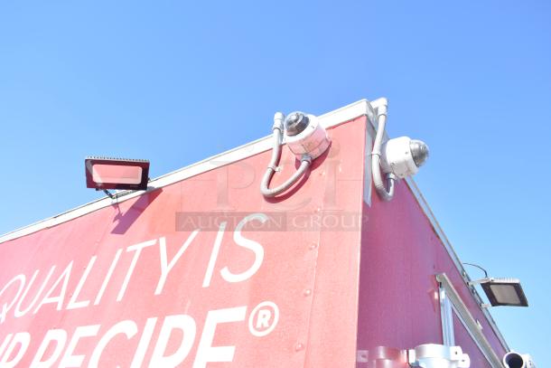Red Rock Solid Cargo fast food trailer, featuring cameras and lighting. Marked with "QUALITY IS OUR RECIPE."