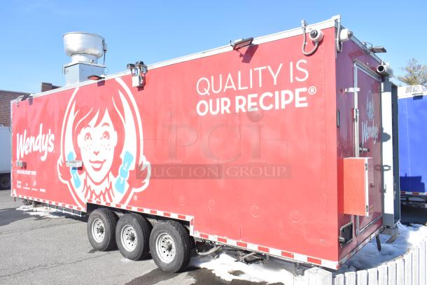 Rock Solid Cargo 2022 fast food trailer with Wendy's branding, fully equipped for high-volume service, vibrant red exterior.