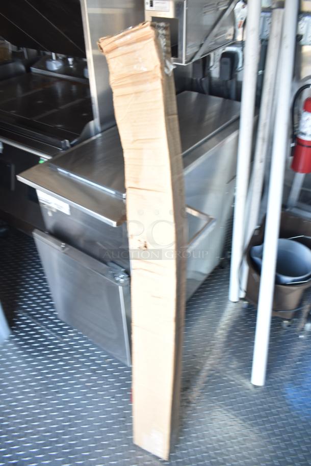 Rock Solid Cargo fast food trailer interior, featuring stainless steel counters and commercial-grade kitchen equipment.