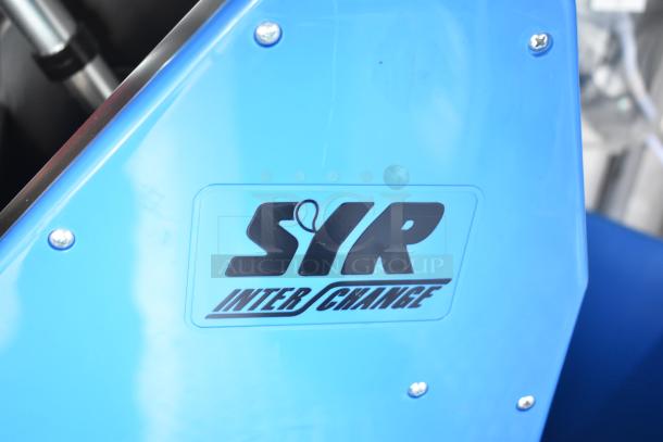 Blue panel with "SIR Interchange" logo; part of Rock Solid Cargo fast food trailer.