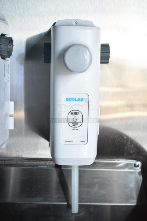 Ecolab water dispenser in Rock Solid Cargo fast food trailer. Features flow control and label for easy identification.