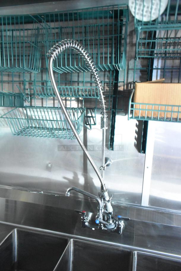Alt Text: Stainless steel sink and faucet setup in Rock Solid Cargo fast food trailer with overhead racks.