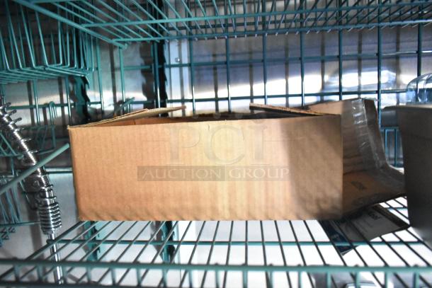 Cardboard box on a metal wire shelf inside a storage area. No visible markings or labels on the box.