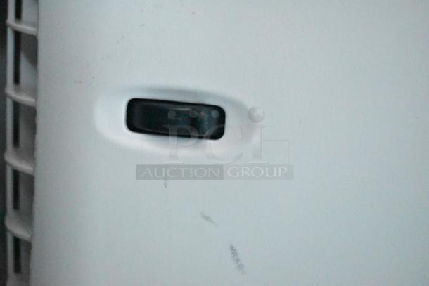 Close-up of a switch on the Rock Solid Cargo Wendy's mobile kitchen trailer, showing part of the ventilation system.