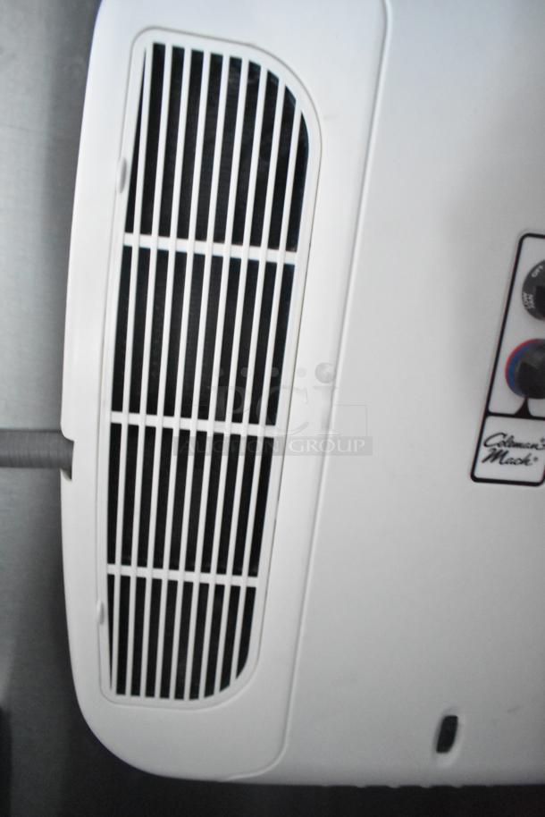 Interior view of Rock Solid Cargo fast food trailer featuring a Coleman-Mach air conditioning unit.