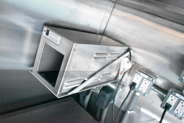 Rock Solid Cargo fast food trailer interior showing electrical outlets and wiring, labeled with Pure-Sine specifications.