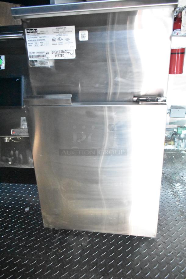 Rock Solid Cargo fast-food trailer with stainless steel cabinet, dielectric tested sticker visible; ideal for high-volume service.