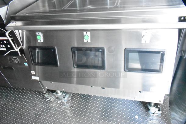 Rock Solid Cargo fast-food trailer interior, featuring commercial-grade equipment including controls and fixtures.