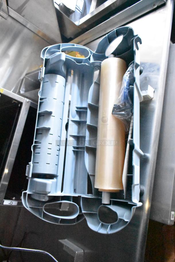 Rock Solid Cargo fast-food trailer interior, showing a storage rack with blue and metallic compartments.