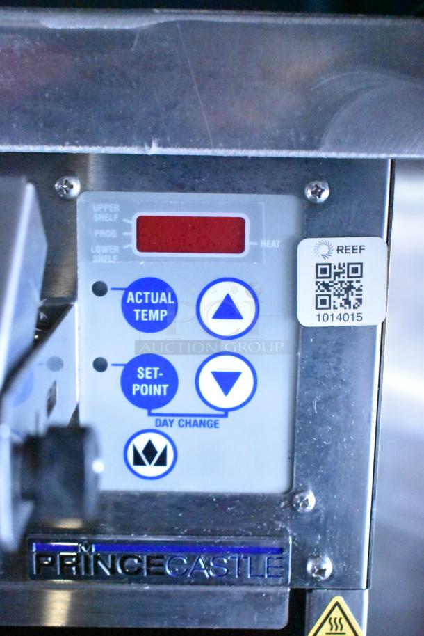 Control panel of a Prince Castle appliance in Rock Solid Cargo food trailer. Displays temperature settings and QR code for REEF.
