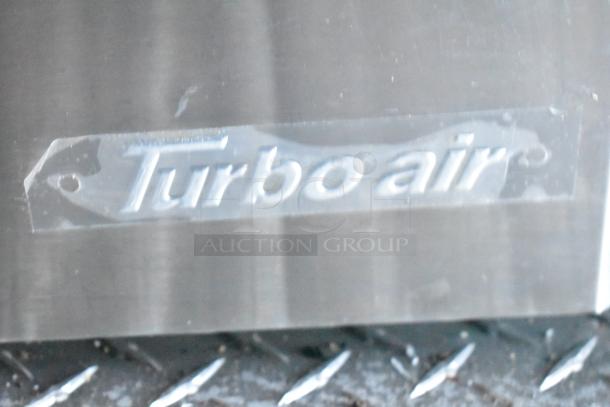 "Turbo Air" label on stainless steel, part of a fully equipped Rock Solid Cargo fast food trailer for auction.