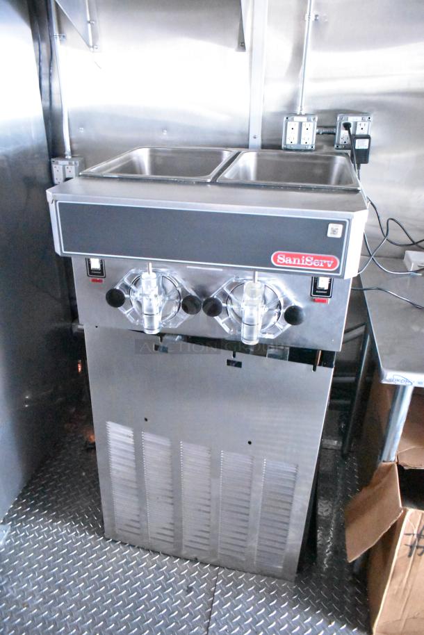 Saniserv ice cream machine in a Rock Solid Cargo Wendy's-style fast food trailer, stainless steel, commercial-grade.