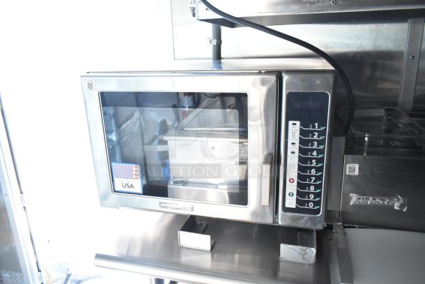 Stainless steel Menumaster commercial microwave in new condition, featuring a digital keypad, labeled "USA" sticker visible.