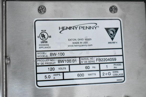 Label on Henny Penny BW-100 fryer, showing UL listing, product number BW100.01, serial number FB2204059, 120 volts, made in USA.