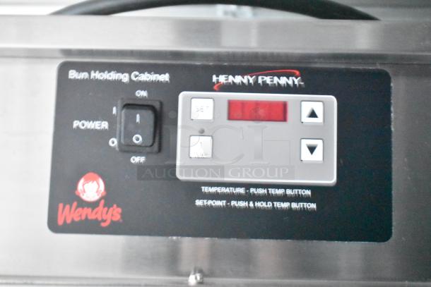 Bun Holding Cabinet control panel for Wendy's fast food trailer by Rock Solid Cargo, with power switch and temperature controls.
