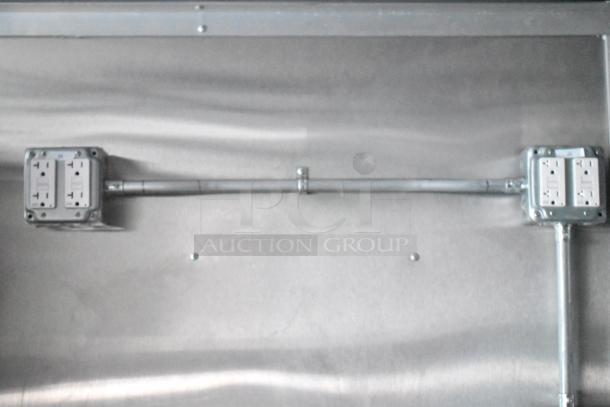 Electrical outlets on interior wall of Rock Solid Cargo fast food trailer, indicating professional wiring.