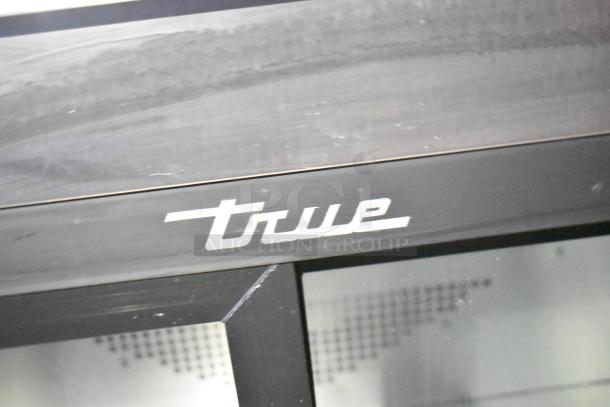 "True" refrigeration branding on Rock Solid Cargo fast food trailer. Key appliance for commercial kitchen setup.