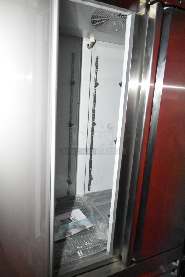 Rock Solid Cargo fast food trailer interior, featuring a metal fan and shelving. New, unused condition.