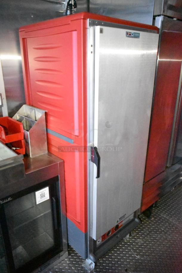 Rock Solid Cargo fast food trailer interior with commercial fridge, red cabinet, and stainless steel surfaces. Turnkey mobile kitchen.