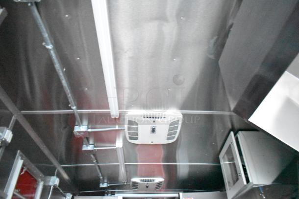 Interior of Rock Solid Cargo fast food trailer ceiling with light fixture and ventilation system, showcasing modern commercial-grade finish.